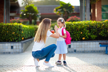 School pick up. Mother and kids after school.