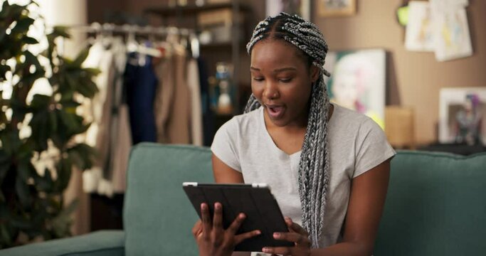 African online language tutor, teaching English to students uses her tablet to conduct virtual lessons share learning materials communicate with students through video calls messaging apps.