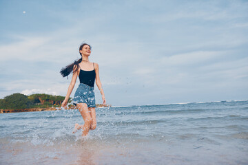 woman lifestyle beach sunset young vacation summer running smile travel sea