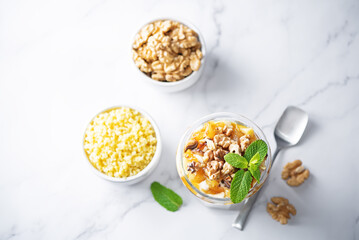 Greek yogurt millet caramelized apple walnuts parfait in a glass
