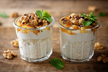 Greek yogurt millet caramelized apple walnuts parfait in a glass