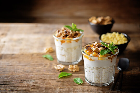 Greek yogurt millet caramelized apple walnuts parfait in a glass