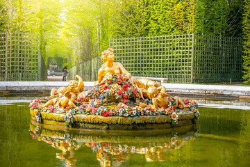 Flora Fountain at the crossroads of several groves in the Gardens of Versailles, Chateau Versailles...