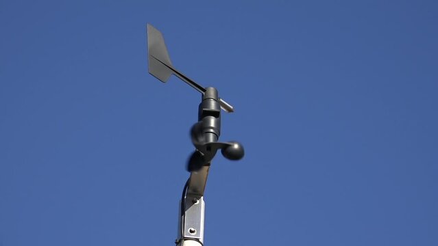 An Anemometer or Windmeter against a blue sky