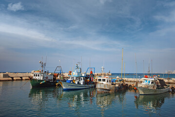 Fototapeta na wymiar fishing boats docking in Jaffa port 