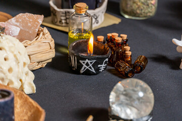 Black magic candles witchcraft composition. Magic ritual satanic tools and items. Halloween and occult black magic ritual imaginary. Ritual scene in dark and frightening atmosphere.
