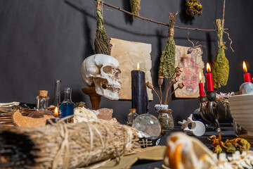 Occult and esoteric witchcraft still life. Halloween background with magic objects. Black candles,...