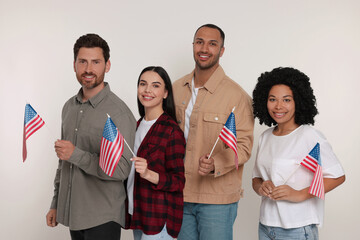 4th of July - Independence Day of USA. Happy friends with American flags on white background