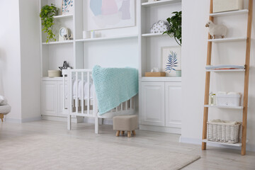 Newborn baby room interior with stylish crib