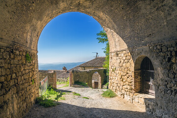 Fototapeta na wymiar Volterra, Italy. Ancient fortress gate with an arch