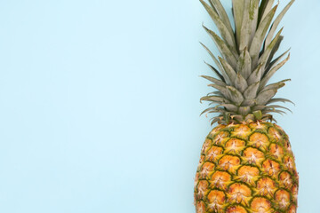 Delicious ripe pineapple on white background, top view. Space for text