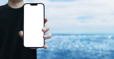 cell phone in a man's hand on the beach with transparent screen png - beach vacation concept