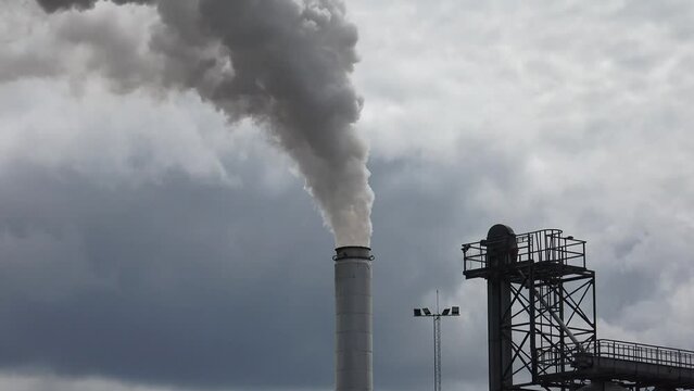 Climate Change And Global Warming caused by air pollution in big factories