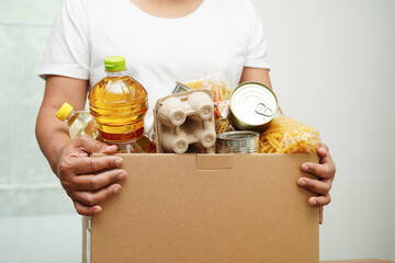 Foodstuffs in donation box for volunteer to help people.