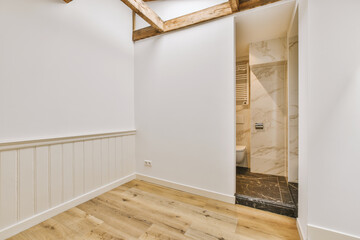 an empty room with wood flooring and white walls in the room is very clean, but it's hard to see how