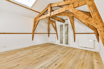 an empty room with wood flooring and skylights on the ceiling, showing how it's going to be