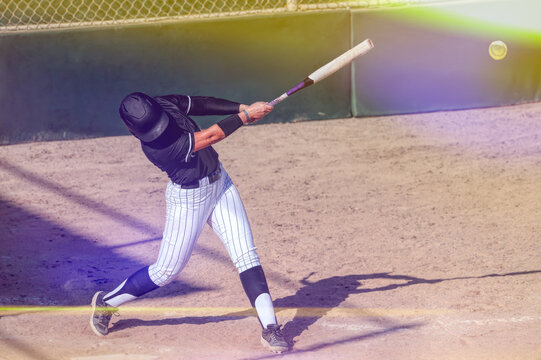 Softball Player Fast Pitch Action Athlete Playing Batter Hitting Baseball