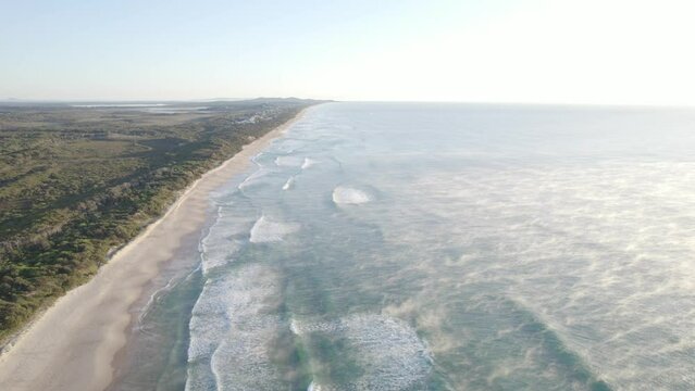 Mist Rising Over The Cold Water Of Sea In Coolum Beach In Early Morning In QLD, Australia. - aerial