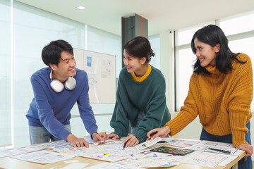Team of ux developer and ui designer brainstorming interface wireframe design.Creative digital...