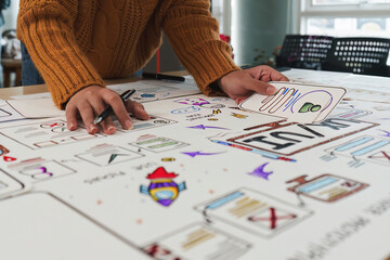 Close up ux developer and ui designer brainstorming interface wireframe design.Creative digital...