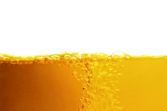 close up of beer bubbles on a white background with space for text