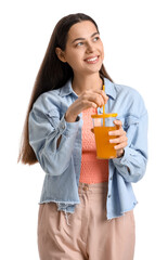 Young woman with glass of vegetable juice on white background