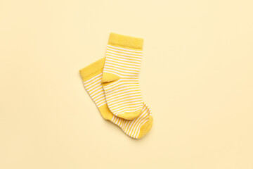 Pair of cotton socks on color background