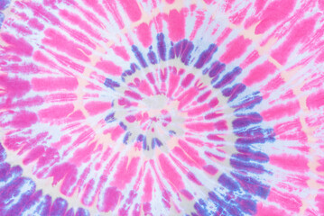 Pink spiral tie dye pattern abstract background.