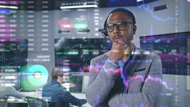 African American financial analyst works in broker agency office. 3D abstract AI animation of real-time stocks and cryptocurrency charts on glass wall. Computers and big digital screens on background.