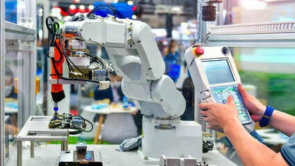 Engineer check and control automation  Modern Robot system in factory, Industry Robot concept .