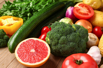 Fresh ripe vegetables on wooden background, closeup