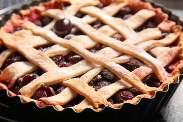 Baking dish with tasty cherry pie, closeup