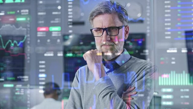 Focused investment specialist analyzes cryptocurrency charts in modern office. 3D render of real-time stocks on glass wall. VFX futuristic animation. Computers and big digital screens on background.