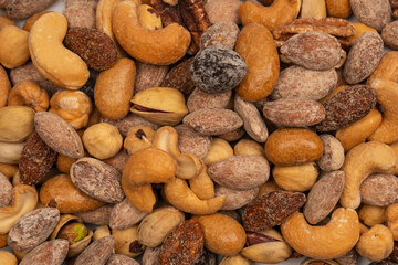 A group of almonds, pistachios, walnuts, macadamia, cashews.