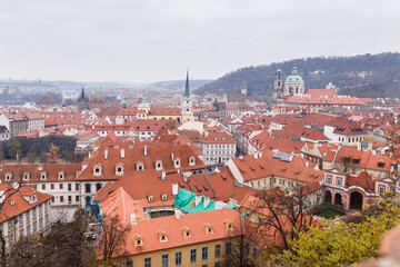 Fototapeta na wymiar red tiled roofs of the medieval European city of Prague in autumn