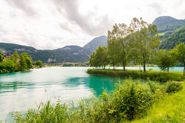 Lake Lungern in summer with blue green clean water, Switzerland
