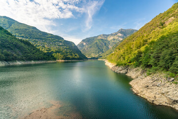 Lago di Vogorno lake in Ticino with green mountains surrounding