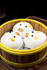 cute piggy buns,healthy and light diet,Cantonese breakfast,Guangdong,China,indoor shot, close-up