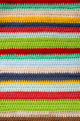 Red, green, blue, beige, aqua, brown, yellow and navy rows, horizontal multi colored crochet lines pattern