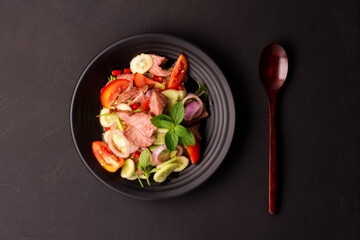 Beef salad with green vegetables Grilled beef salad Thai food Healthy beef salad menu with tomato pepper, garlic, spices Lunch Dinner