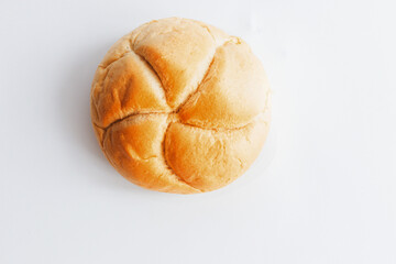 Bread rolls with wheat ears. on a white background. Close-up.