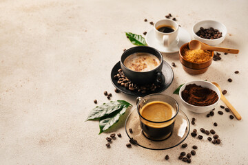 Coffee cups on light beige background . Copy space. Top view