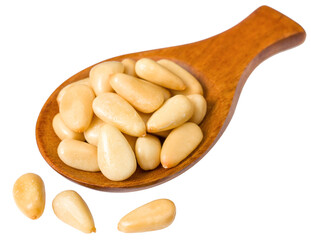 Roasted pine nuts in the wooden spoon, isolated on the white background.