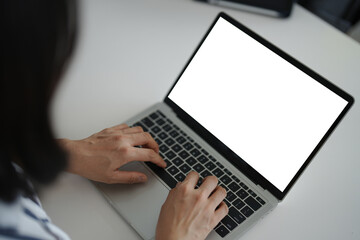 A short hair woman is working and typing on a laptop to connect business and search for information