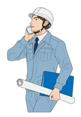 スマホで取引先に電話する若手の現場監督