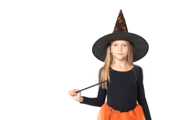 A beautiful cute girl in a witch costume, wearing a hat and with a magic wand on a white background