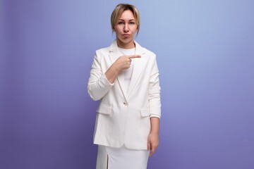 smart young blond office woman in a white jacket gesturing with her hands for confidence