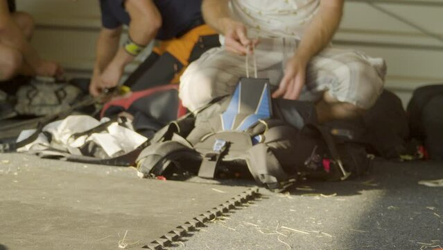 Folding a parachute into a backpack. Safety procedures before parachute jumps.