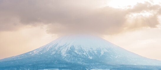 Beautiful Yotei Mountain with Snow in winter season at Niseko. landmark and popular for Ski and Snowboarding tourists attractions in Hokkaido, Japan. Travel and Vacation concept - obrazy, fototapety, plakaty