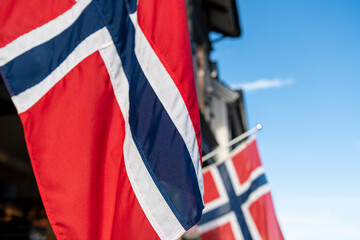 Flag of Norway blowing in the wind, Tromso city - stock photo